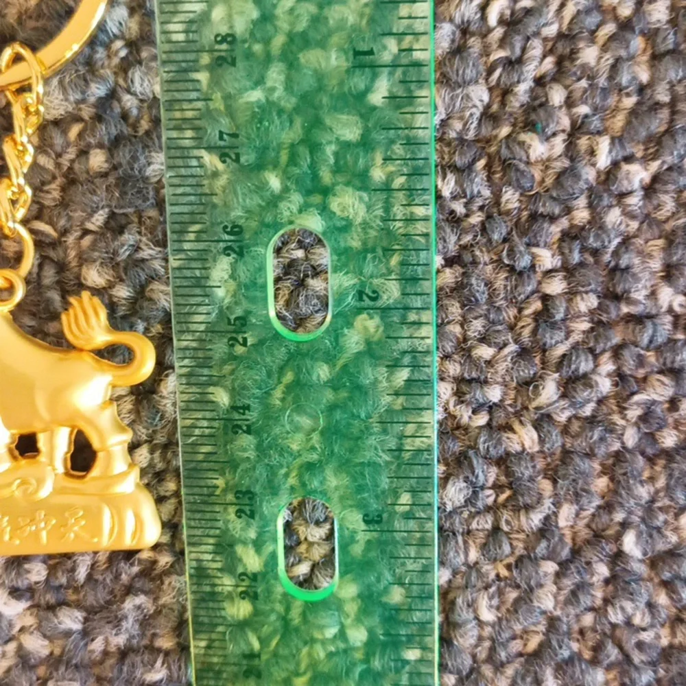 Good luck Cow keychain gold tone